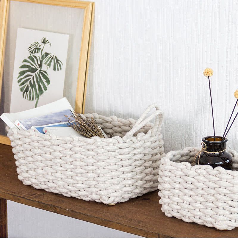 Nordic hand-woven cotton storage basket styled on a shelf