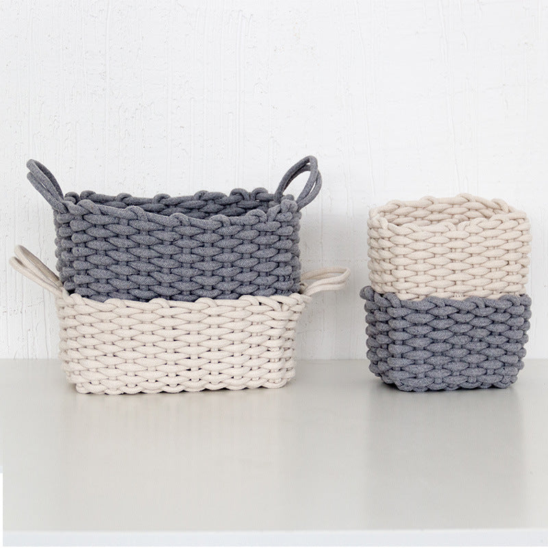 Cotton rope storage basket holding folded blankets